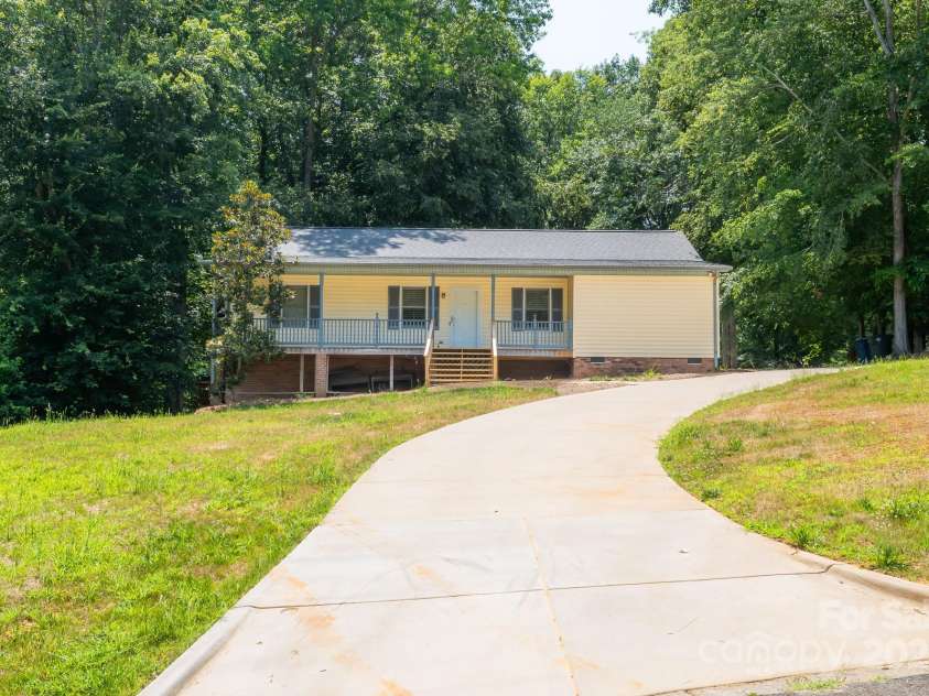 103 Sycamore Road, Salisbury, NC 28147.  MLS# CAR4265869, YatesRealty ID 28144. Front of house with new paved driveway! Rocking chair front porch