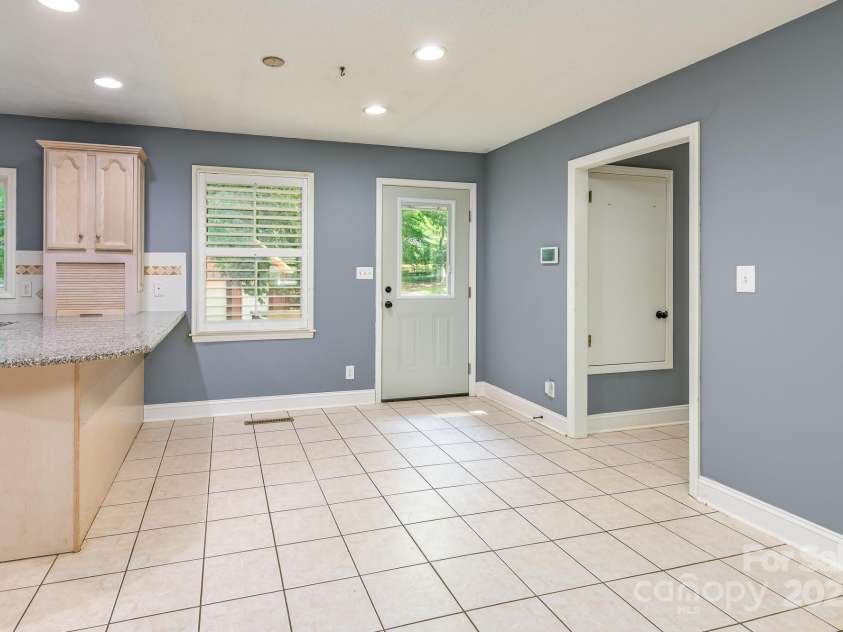 103 Sycamore Road, Salisbury, NC 28147.  MLS# CAR4265869, YatesRealty ID 28144. Kitchen dining looking into right hallway showing pantry