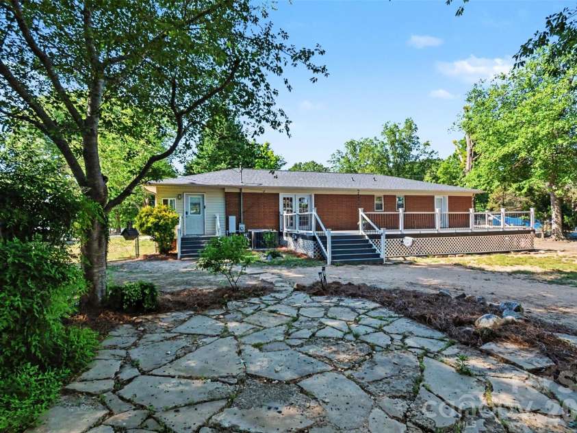 738 Edgemoor Drive, Mooresville, NC 28115.  MLS# CAR4382810, YatesRealty ID 28144. Backyard stone patio