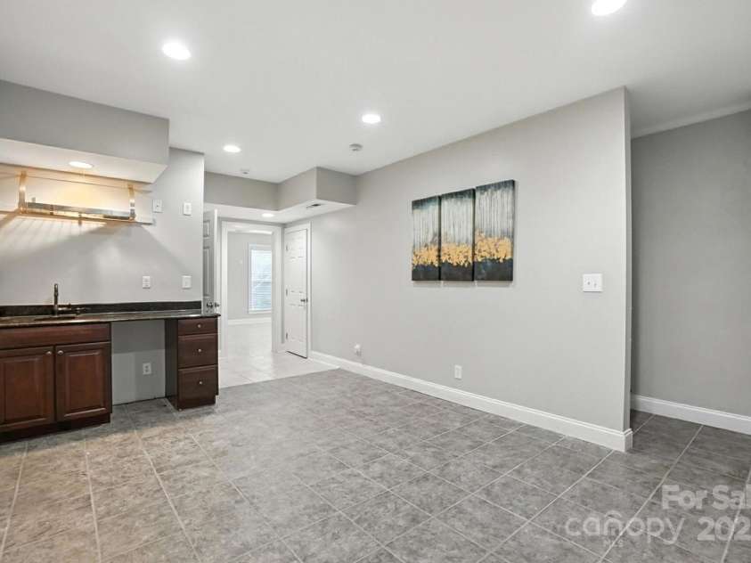 5807 Mctaggart Lane, Charlotte, NC 28269.  MLS# CAR4237626, YatesRealty ID 28147. Basemenht Bar