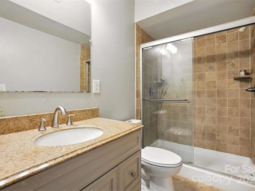 5807 Mctaggart Lane, Charlotte, NC 28269.  MLS# CAR4237626, YatesRealty ID 28147. Basement full bath