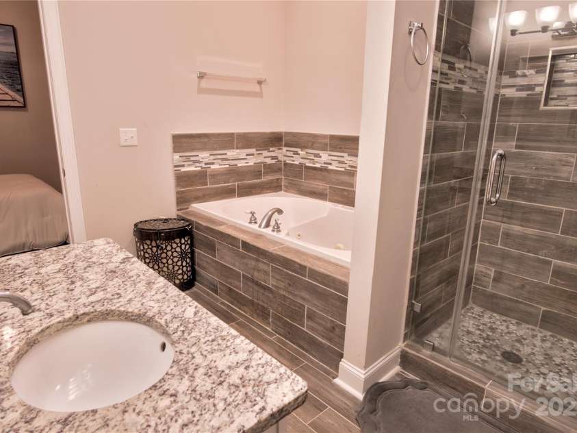 143 Gibbs Road, Mooresville, NC 28117.  MLS# CAR4244508, YatesRealty ID 28148. Full basement bath with granite and tile