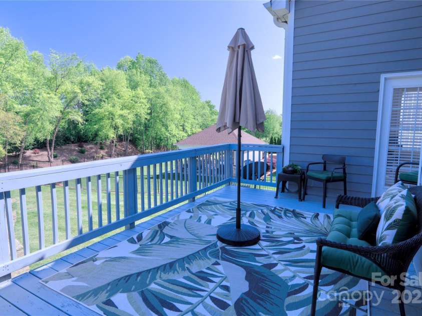 143 Gibbs Road, Mooresville, NC 28117.  MLS# CAR4244508, YatesRealty ID 28148. Large deck overlooking backyard