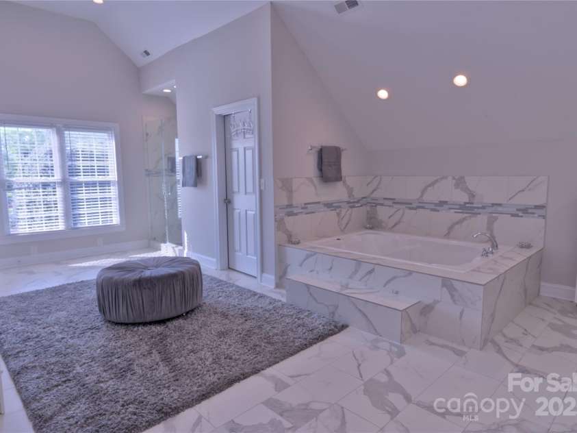 143 Gibbs Road, Mooresville, NC 28117.  MLS# CAR4244508, YatesRealty ID 28148. Large primary bath en suite