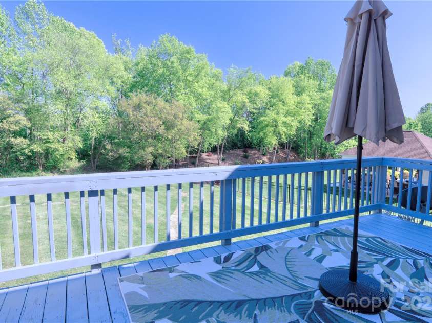 143 Gibbs Road, Mooresville, NC 28117.  MLS# CAR4244508, YatesRealty ID 28148. Private yard with trees