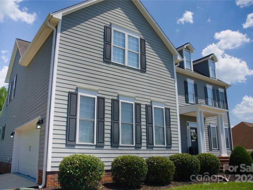 143 Gibbs Road, Mooresville, NC 28117.  MLS# CAR4244508, YatesRealty ID 28148. Side view with oversized garage