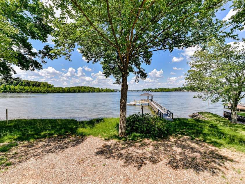 9115 Clement Circle, Terrell, NC 28682.  MLS# CAR4255076, YatesRealty ID 28149. Picturesque, Main Channel Water Views with Fully Renovated (2022), Full Brick, 5 Bedroom, 4 Full Bath Home with private Pier/Covered Dock on beautiful Lake Norman!