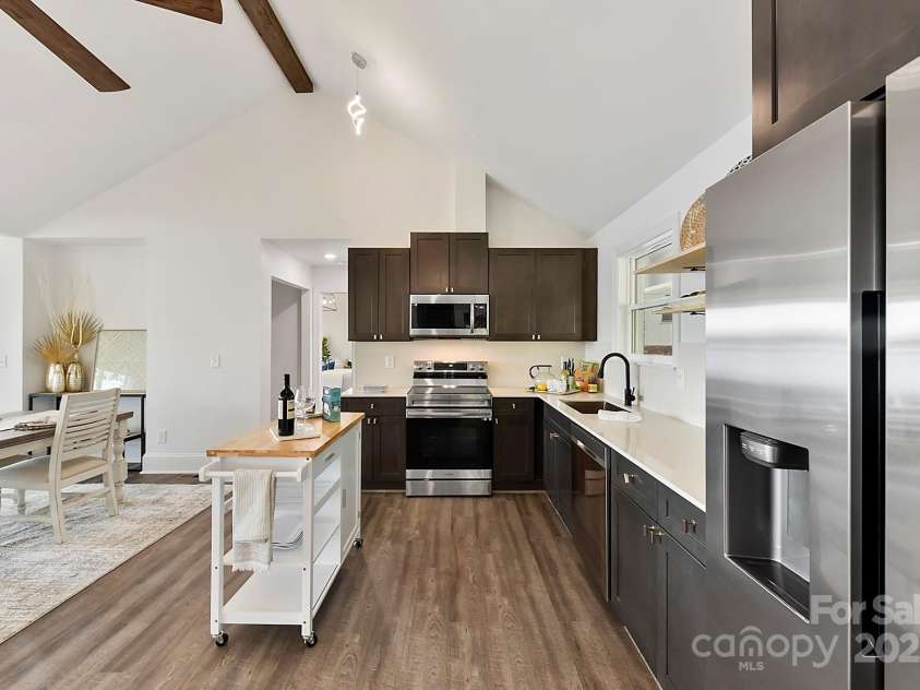 9115 Clement Circle, Terrell, NC 28682.  MLS# CAR4255076, YatesRealty ID 28149. Upgraded, Vaulted Kitchen with quartz counters, stainless steel appliances, plenty of cabinetry for storage & Dining Area!