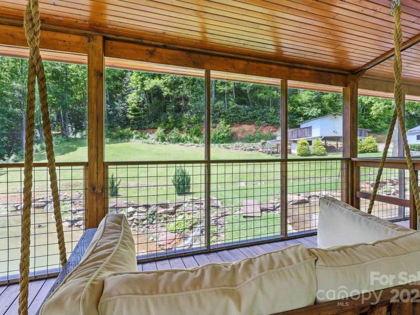 170 Penley Road, Lenoir, NC 28645.  MLS# CAR4265025, YatesRealty ID 28154. Screened Porch Swing