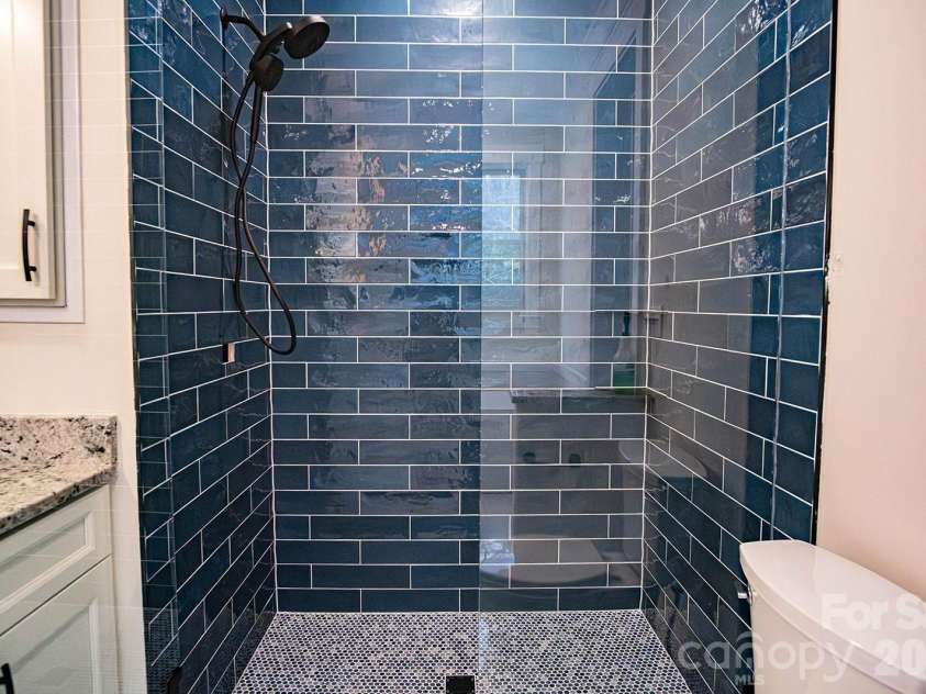 10 McMurray Lane, Black Mountain, NC 28711.  MLS# CAR4333892, YatesRealty ID 2816. Tile shower