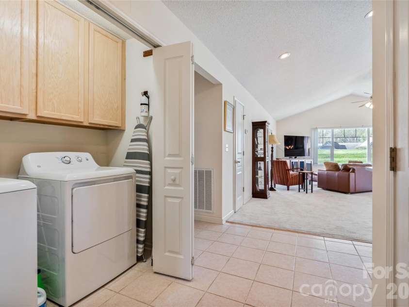 47 Barn Owl Way, Hendersonville, NC 28792.  MLS# CAR4367835, YatesRealty ID 28166. Laundry closet in the hall