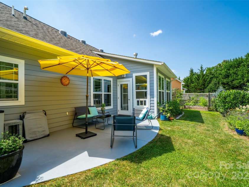 89 Weaver Village Way, Weaverville, NC 28787.  MLS# CAR4278946, YatesRealty ID 28169. Rear Patio and Perennial Gardens