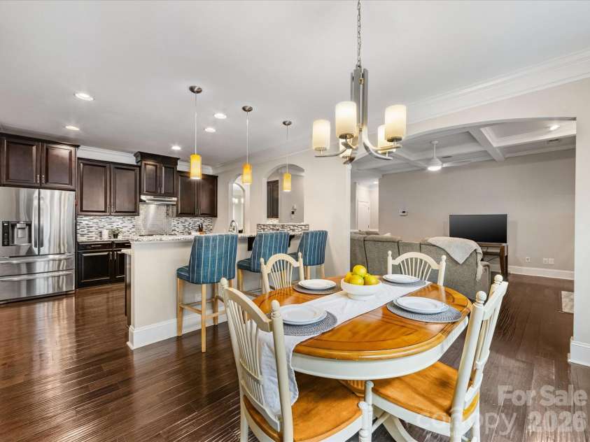 9311 Scorpio Lane, Mint Hill, NC 28227.  MLS# CAR4372655, YatesRealty ID 28169. Large open kitchen with gleaming hardwoods, custom cabinetry and tile backsplash!
