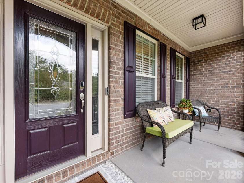 9311 Scorpio Lane, Mint Hill, NC 28227.  MLS# CAR4372655, YatesRealty ID 28169. Relax on the porch!
