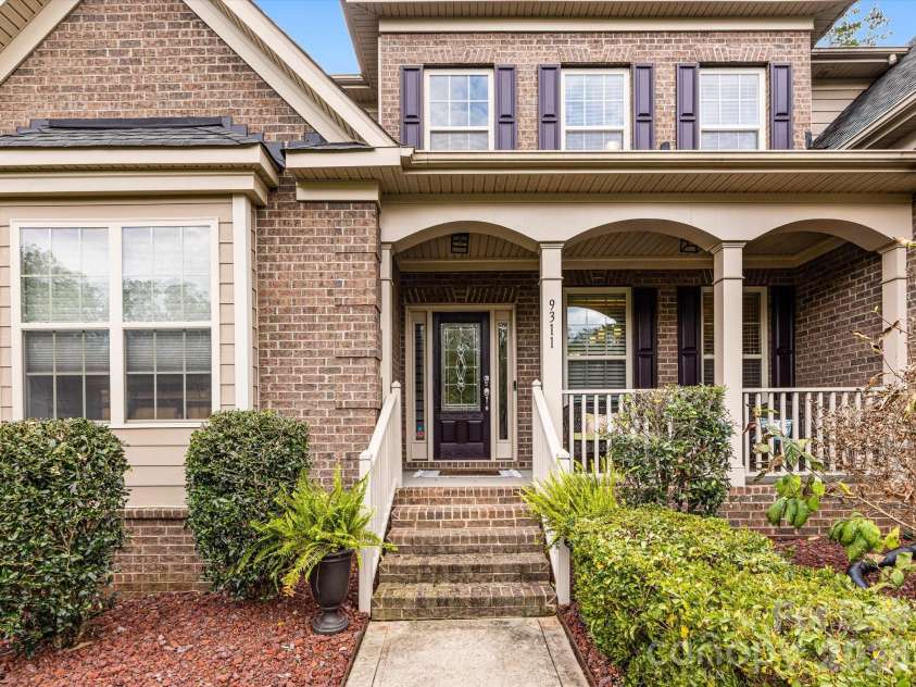 9311 Scorpio Lane, Mint Hill, NC 28227.  MLS# CAR4372655, YatesRealty ID 28169. Welcoming covered front porch area