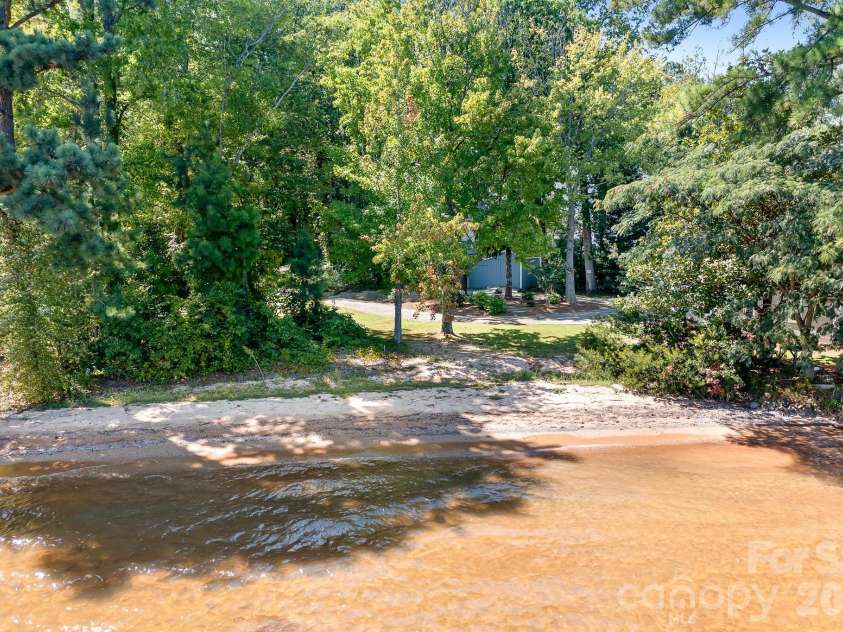 8293 Luckey Point Road, Denver, NC 28037.  MLS# CAR4303572, YatesRealty ID 2817. Private natural beach area.