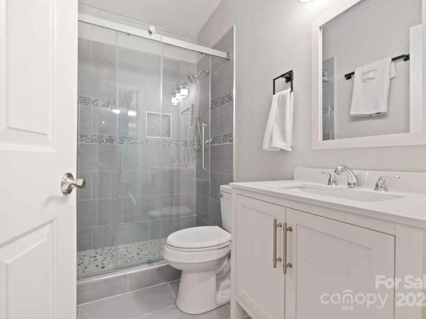 21 Moriah Lane, Asheville, NC 28803.  MLS# CAR4277653, YatesRealty ID 28171. Lower level full bathroom