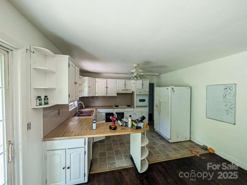 59 Poteat Street, Fletcher, NC 28732.  MLS# CAR4277892, YatesRealty ID 28173. Kitchen could use an update.