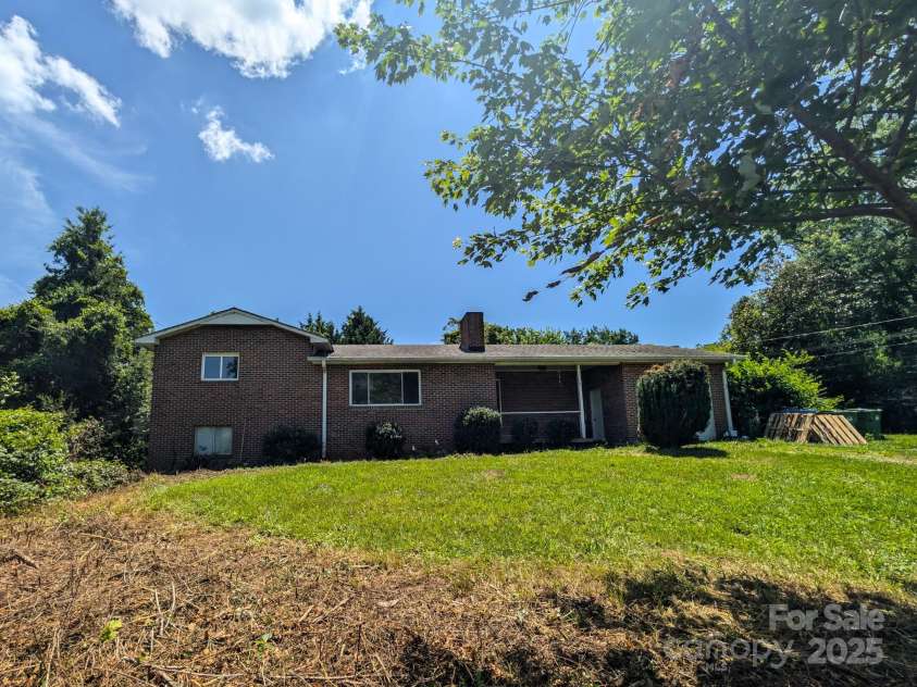 59 Poteat Street, Fletcher, NC 28732.  MLS# CAR4277892, YatesRealty ID 28173. Large front yard.