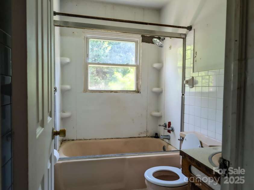 59 Poteat Street, Fletcher, NC 28732.  MLS# CAR4277892, YatesRealty ID 28173. Main bath could use some love.
