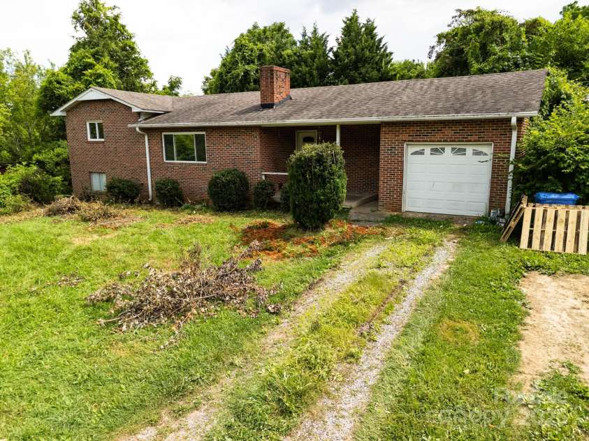 59 Poteat Street, Fletcher, NC 28732.  MLS# CAR4277892, YatesRealty ID 28173. Side garage is quite useful but there's also a basement garage.