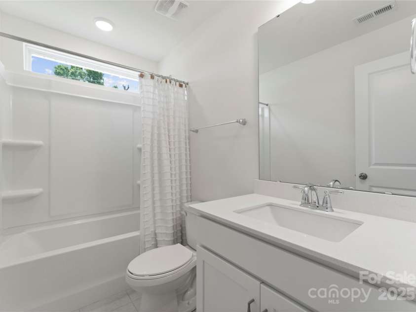 1022 Moffatt Lane, Matthews, NC 28105.  MLS# CAR4275398, YatesRealty ID 28175. Hallway Bathroom