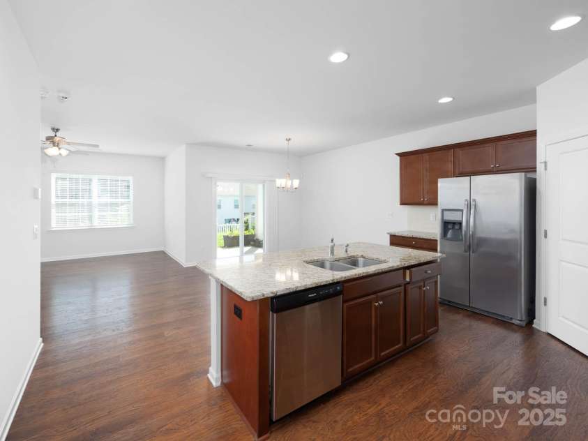 170 Atwater Landing Drive, Mooresville, NC 28117.  MLS# CAR4249384, YatesRealty ID 28180. Kitchen, dining area and part of the great room.