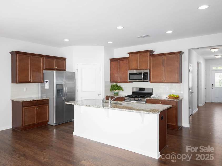 170 Atwater Landing Drive, Mooresville, NC 28117.  MLS# CAR4249384, YatesRealty ID 28180. Kitchen with large pantry.  Refrigerator included.