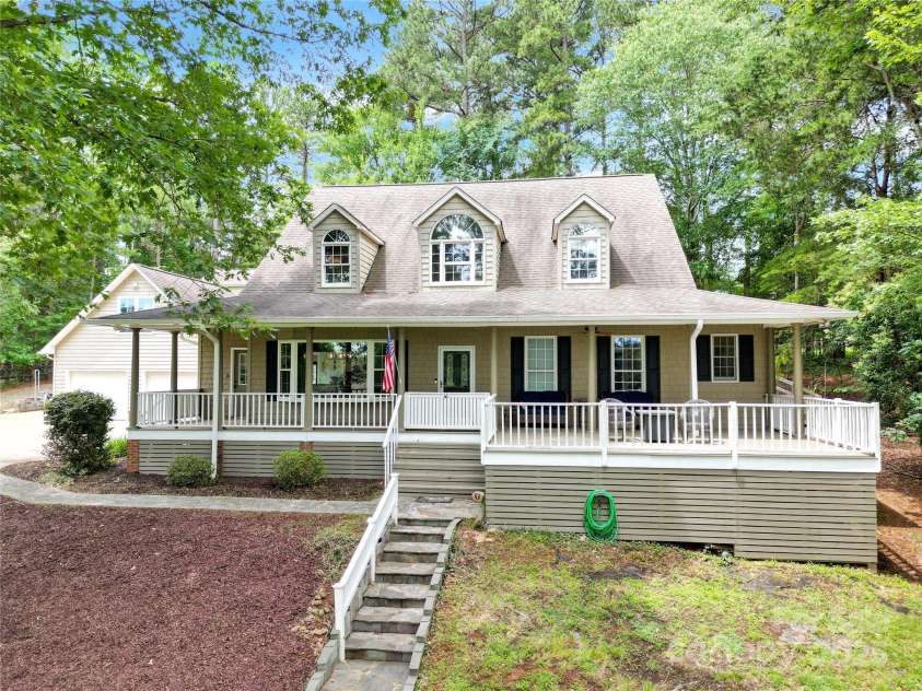 832 Kemp Road, Mooresville, NC 28117.  MLS# CAR4264266, YatesRealty ID 28181. Front of Home.  Stone stairs lead to front porch/front door.