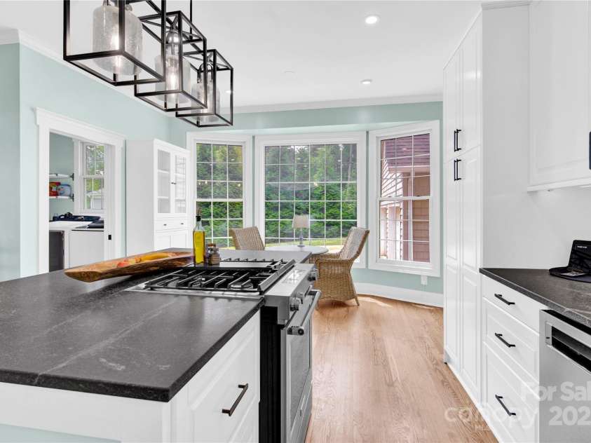 832 Kemp Road, Mooresville, NC 28117.  MLS# CAR4264266, YatesRealty ID 28181. Kitchen with Island and homed granite.