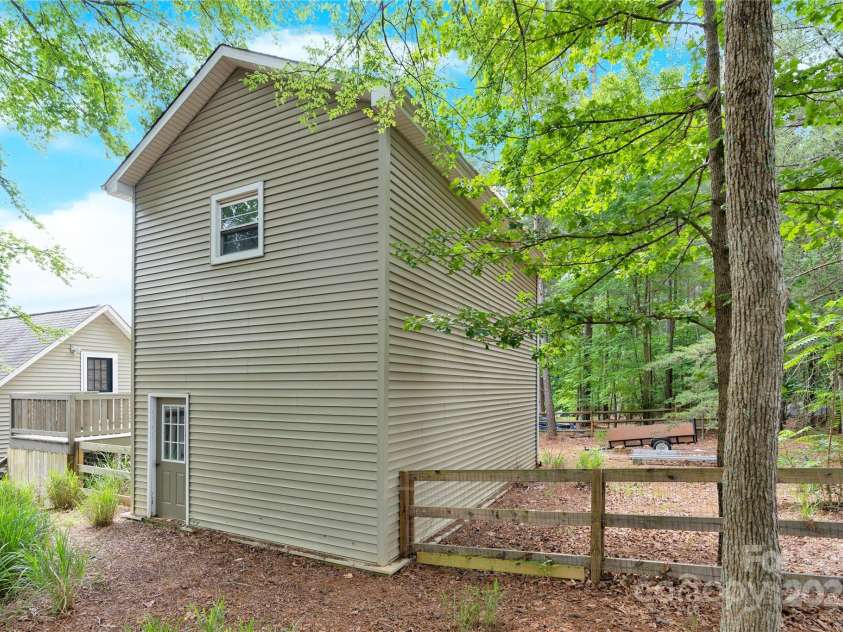832 Kemp Road, Mooresville, NC 28117.  MLS# CAR4264266, YatesRealty ID 28181. View of back of two story outbuilding.
