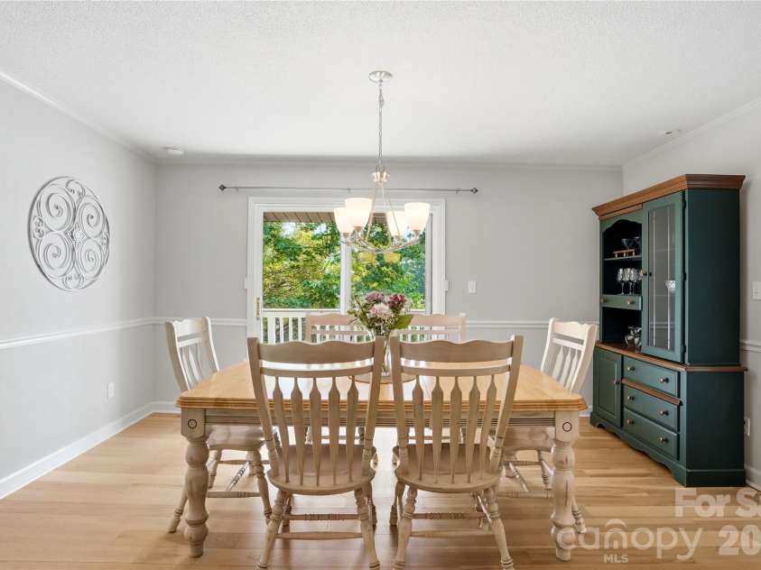 1113 Palmyra Drive, Tega Cay, SC 29708.  MLS# CAR4379735, YatesRealty ID 28182. Dining room framed by picturesque water views