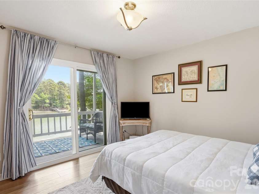 1113 Palmyra Drive, Tega Cay, SC 29708.  MLS# CAR4379735, YatesRealty ID 28182. Secondary bedroom with lake views