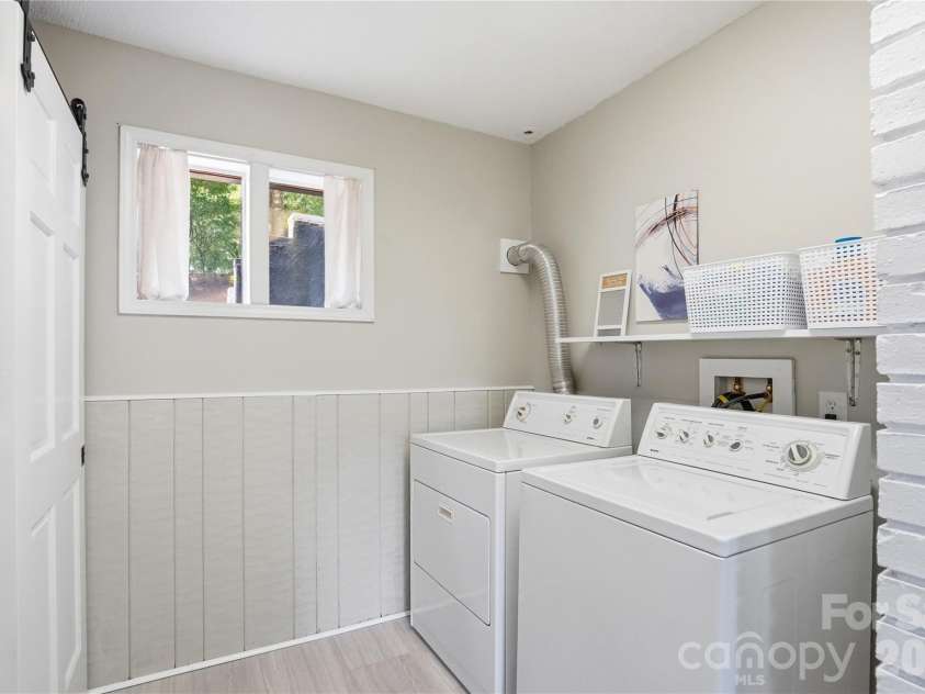1113 Palmyra Drive, Tega Cay, SC 29708.  MLS# CAR4379735, YatesRealty ID 28182. Stylish laundry room complete with a trendy barn door