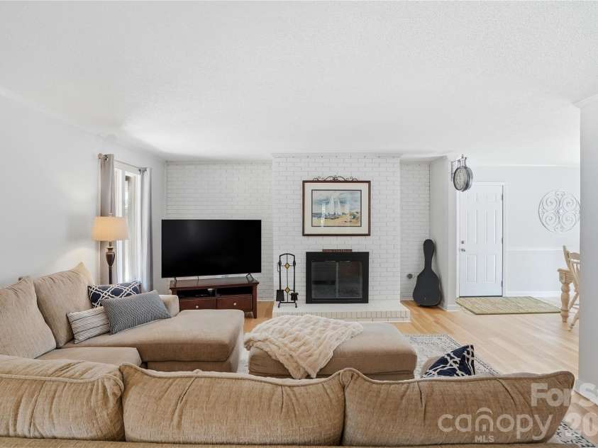 1113 Palmyra Drive, Tega Cay, SC 29708.  MLS# CAR4379735, YatesRealty ID 28182. The spacious great room with fireplace