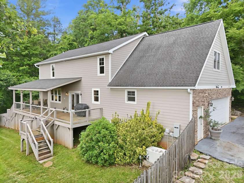 65 Buckle Ridge, Weaverville, NC 28787.  MLS# CAR4383758, YatesRealty ID 28184. Back deck and two car garage.