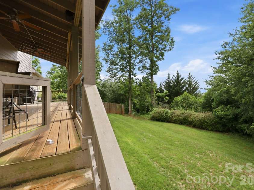 65 Buckle Ridge, Weaverville, NC 28787.  MLS# CAR4383758, YatesRealty ID 28184. Deck overlooking the backyard.