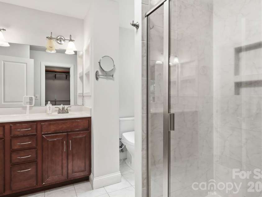 65 Buckle Ridge, Weaverville, NC 28787.  MLS# CAR4383758, YatesRealty ID 28184. Ensuite bathroom with shower.