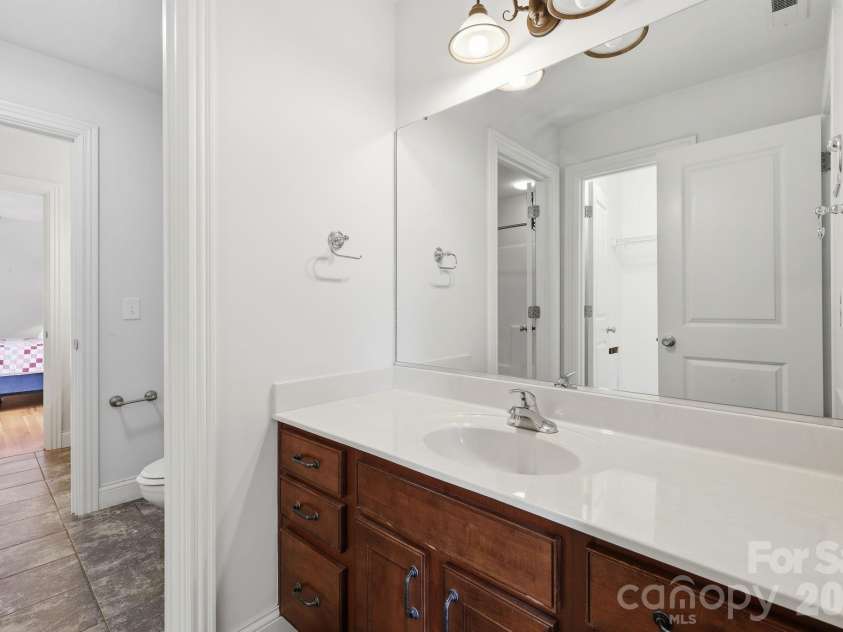 65 Buckle Ridge, Weaverville, NC 28787.  MLS# CAR4383758, YatesRealty ID 28184. Jack and Jill bathroom.