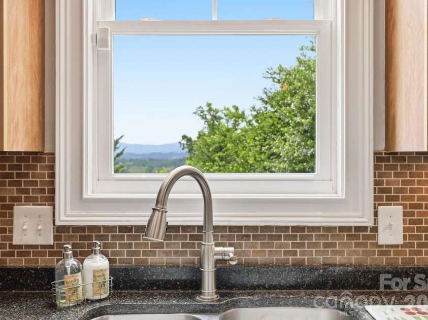 65 Buckle Ridge, Weaverville, NC 28787.  MLS# CAR4383758, YatesRealty ID 28184. Mountain views while doing your dishes.