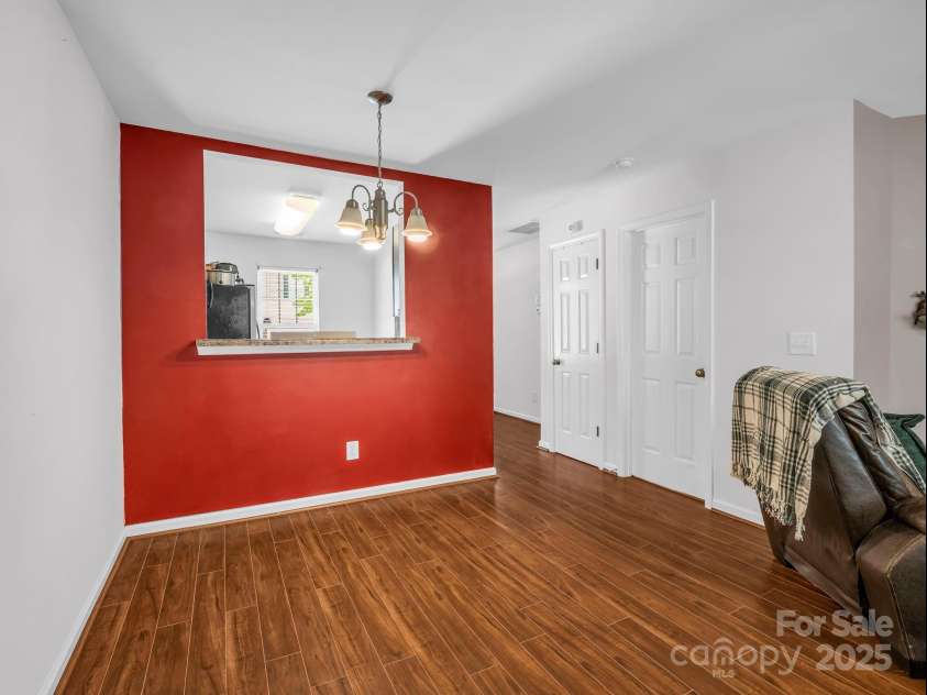 137 Thea Lane, Fletcher, NC 28732.  MLS# CAR4282031, YatesRealty ID 28187. From dining area/living room looking into kitchen and towards 1/2 bath