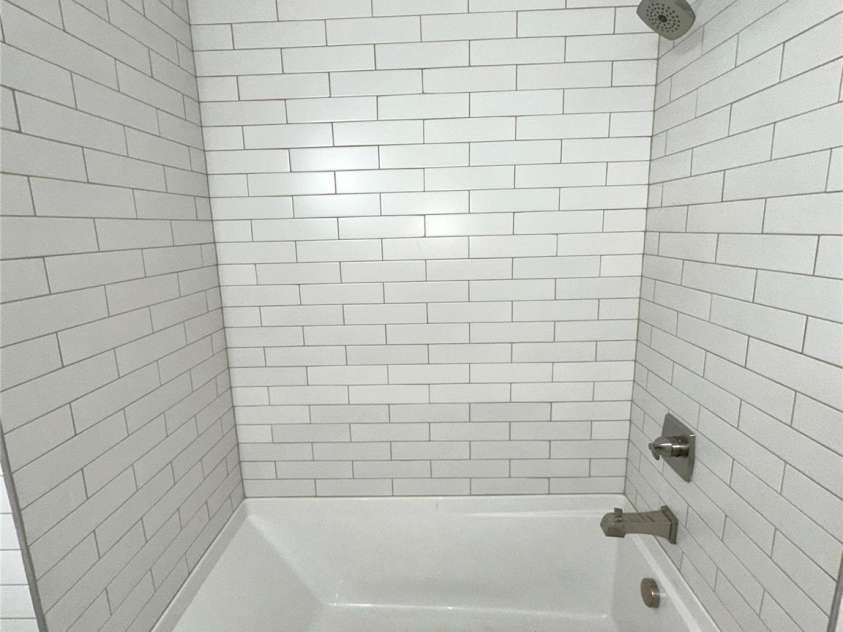 112 Maple Street, Shelby, NC 28150.  MLS# CAR4192952, YatesRealty ID 2819. Subway tiled shower/bath surround