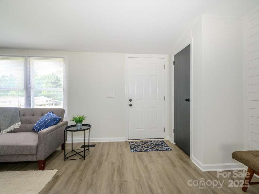 4833 Verde View Drive, Gastonia, NC 28056.  MLS# CAR4276387, YatesRealty ID 28190. View of front door with back to kitchen area.