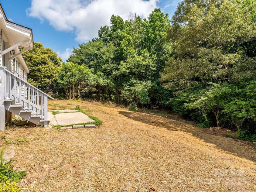 4833 Verde View Drive, Gastonia, NC 28056.  MLS# CAR4276387, YatesRealty ID 28190. View of large back yard freshly seeded for lawn.