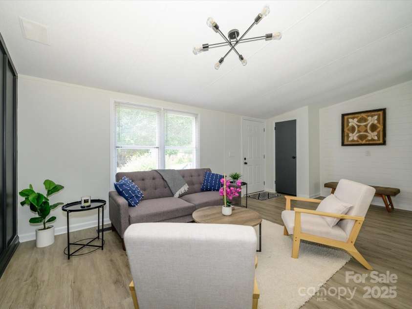 4833 Verde View Drive, Gastonia, NC 28056.  MLS# CAR4276387, YatesRealty ID 28190. View with back to primary bedroom of family room.