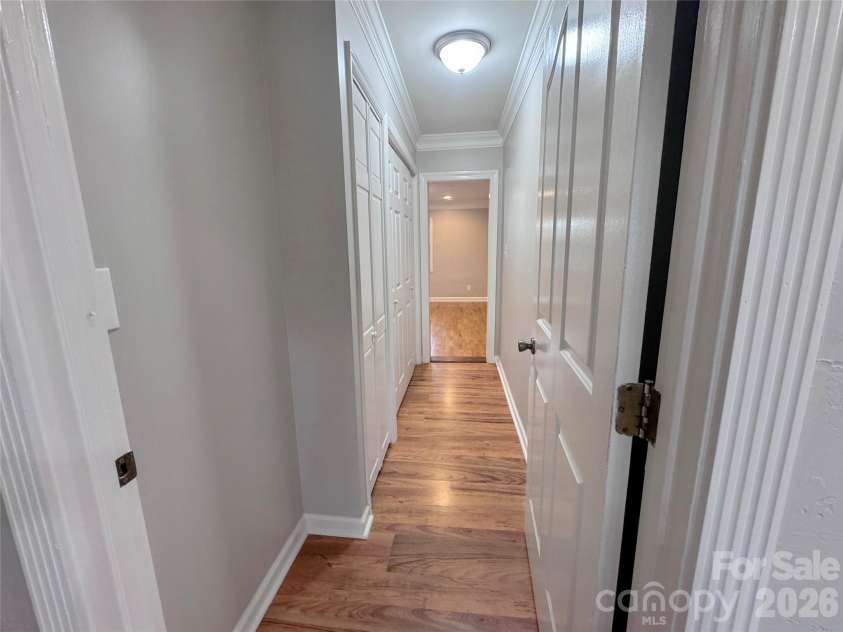 21123 Rio Oro Drive, Cornelius, NC 28031.  MLS# CAR4387095, YatesRealty ID 28192. Hallway leading to Owner's Suite
