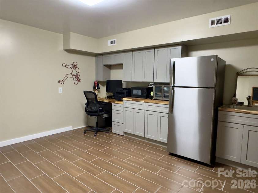 52 Cheshire Drive, Black Mountain, NC 28711.  MLS# CAR4387105, YatesRealty ID 28195. Basement Studio Apartment/Office/Gym