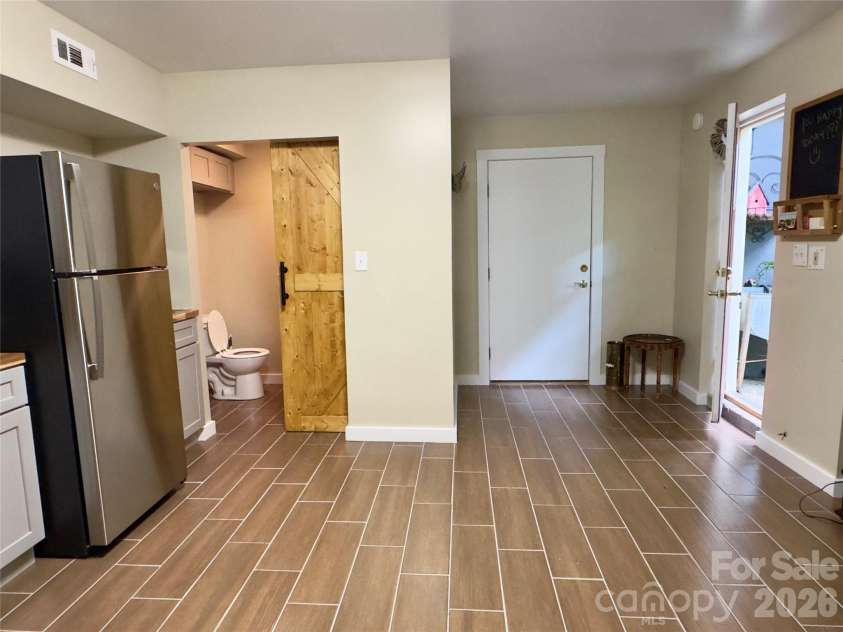 52 Cheshire Drive, Black Mountain, NC 28711.  MLS# CAR4387105, YatesRealty ID 28195. Full bath and access to crawlspace.