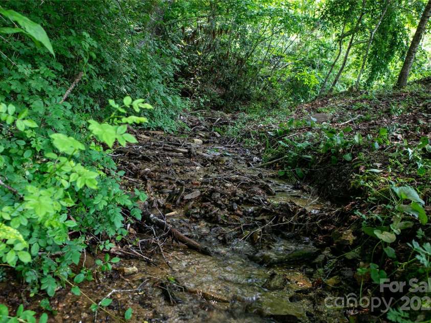 903 Middlefork Road, Brevard, NC 28712.  MLS# CAR4259647, YatesRealty ID 28206. Boarders the Creek