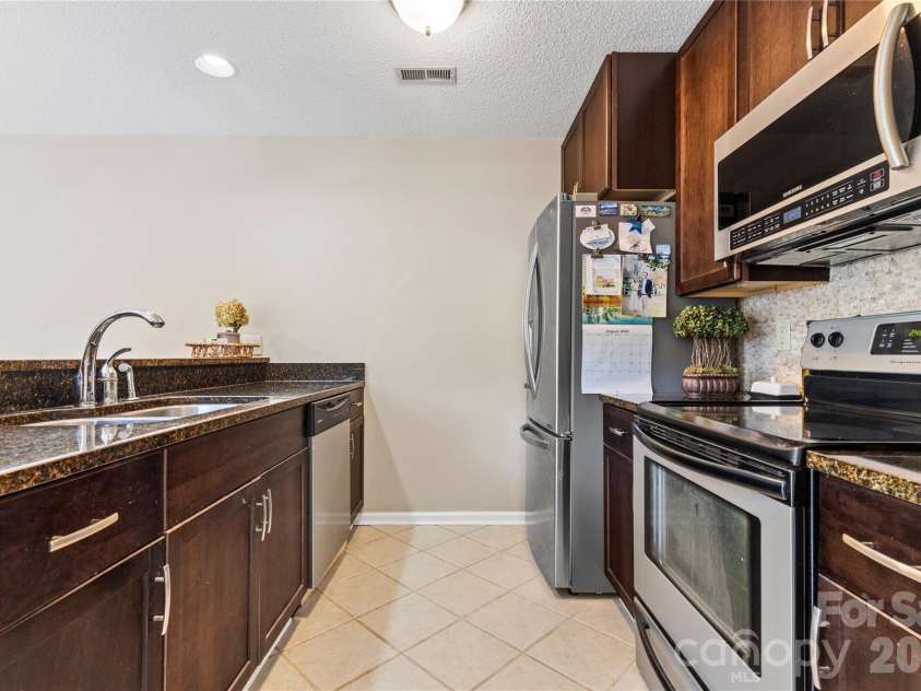 719 Southwest Drive, Davidson, NC 28036.  MLS# CAR4373406, YatesRealty ID 28209. 